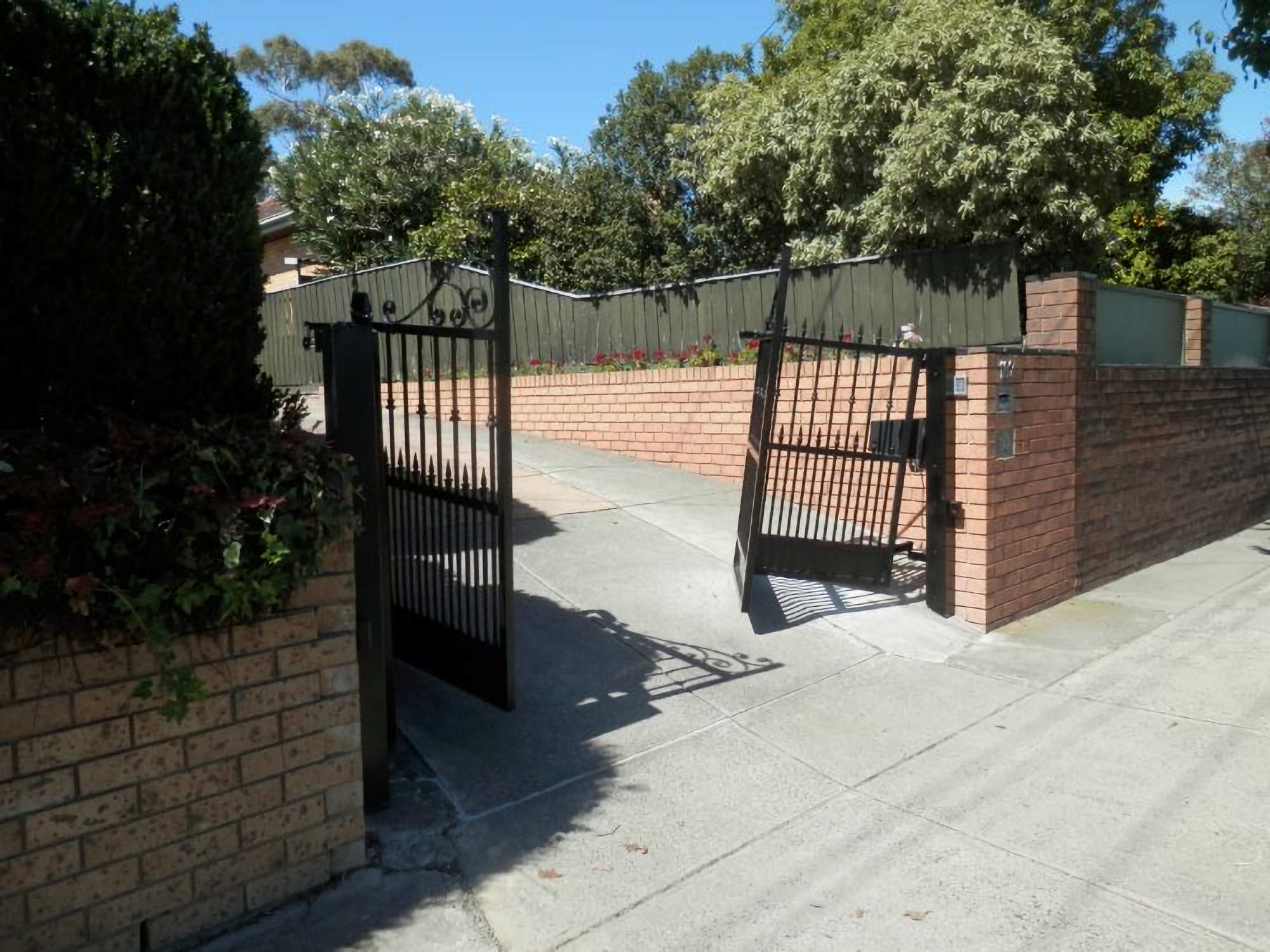 Motorised Gate Company Melbourne - bi-fold gates sloping driveways