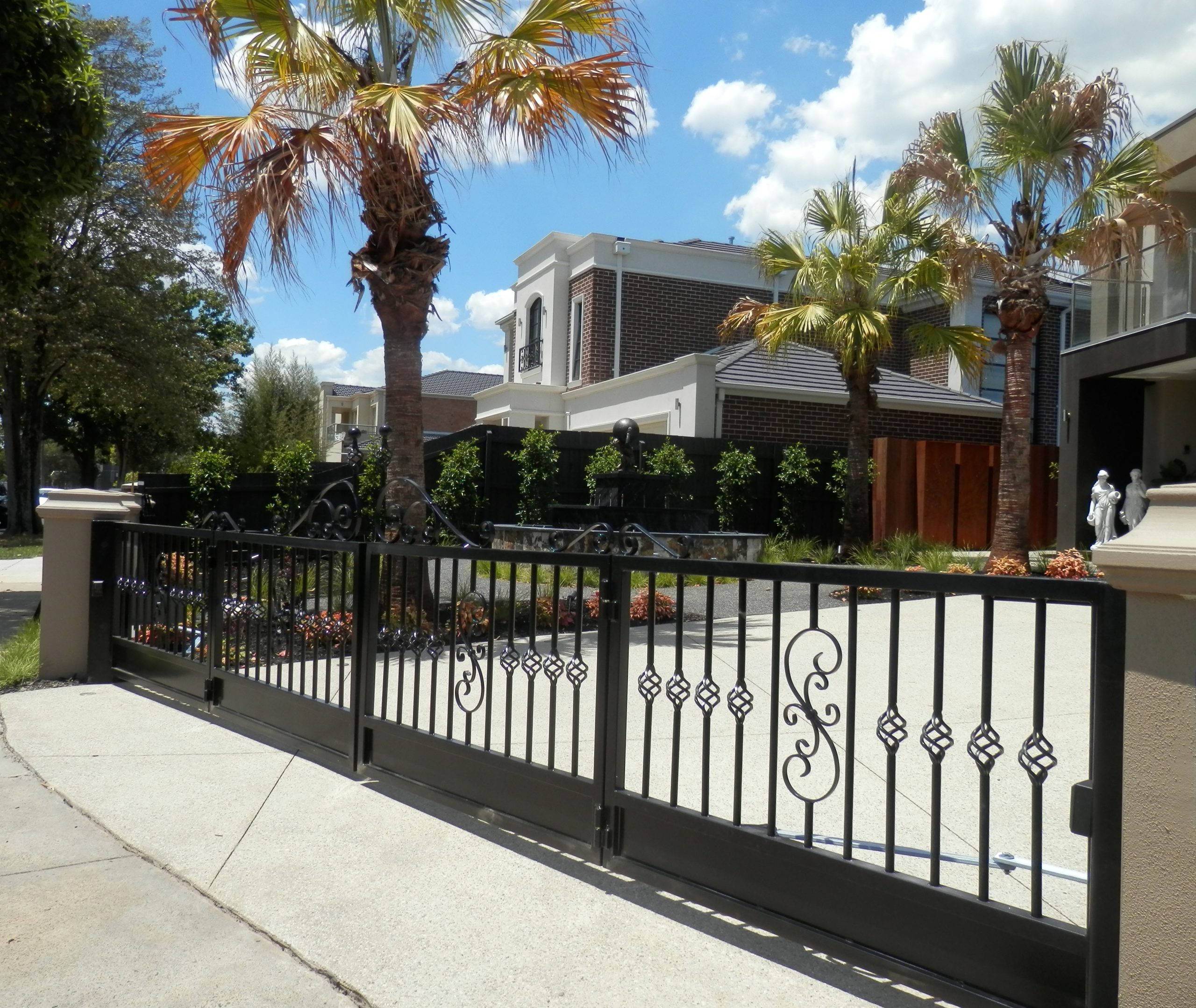 Automatic Trackless Bi-Fold Gates for Wide Driveways The Motorised Gate Company